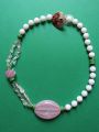 Asymmetrical necklace in pink, green and white glass beads